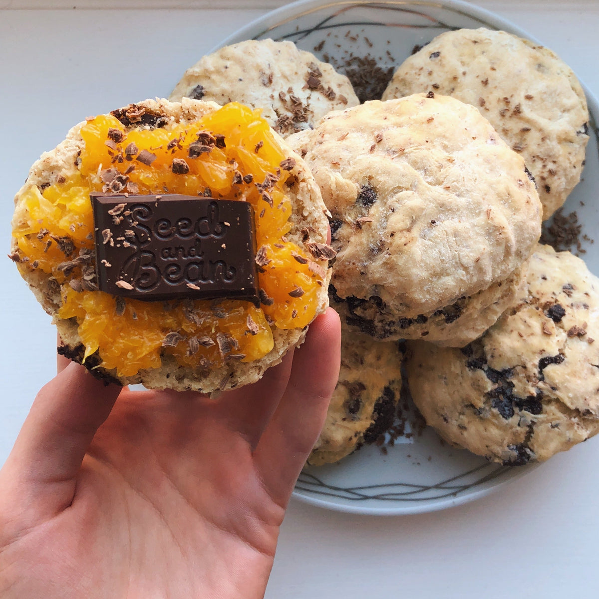 Mandarin and ginger chocolate scones on a baking tray