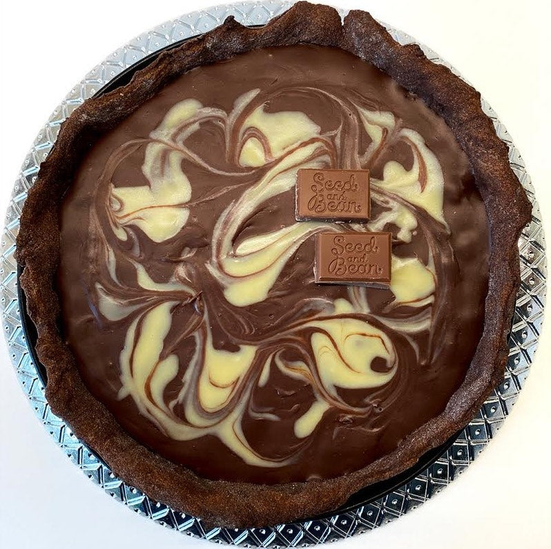 Chocolate ganache tart topped with caramelised hazelnuts