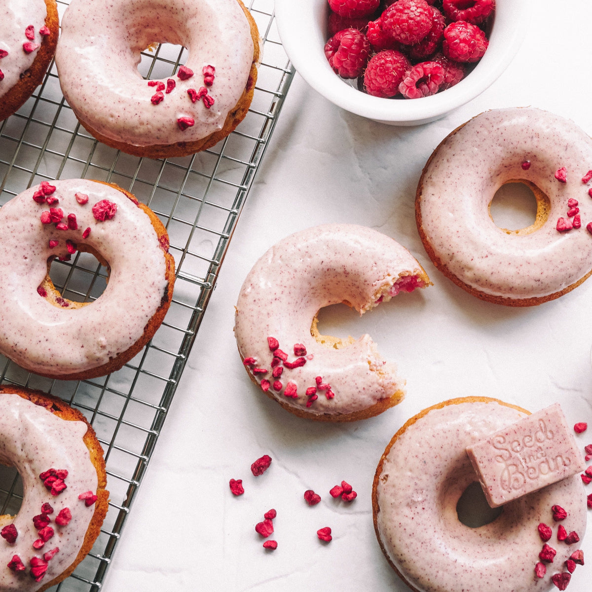 Baked vanilla and raspberry doughnuts with glaze