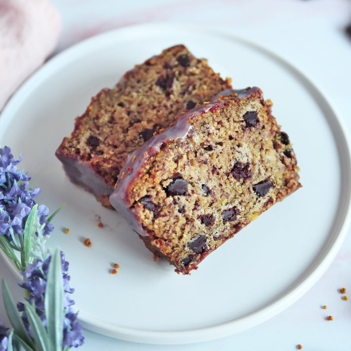 Vegan banana bread with lavender chocolate chunks and glaze