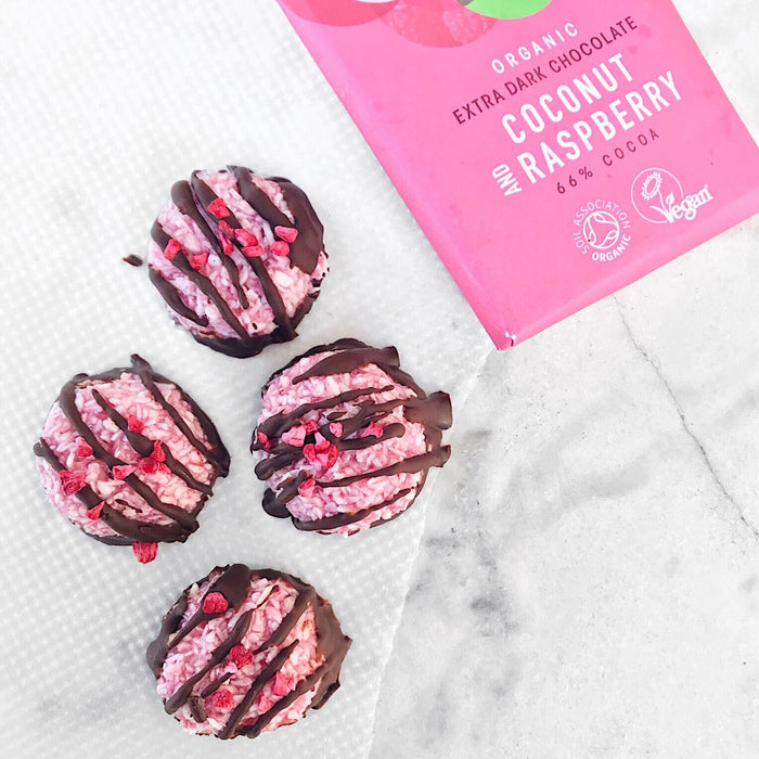 Pink coconut macaroons dipped in dark chocolate