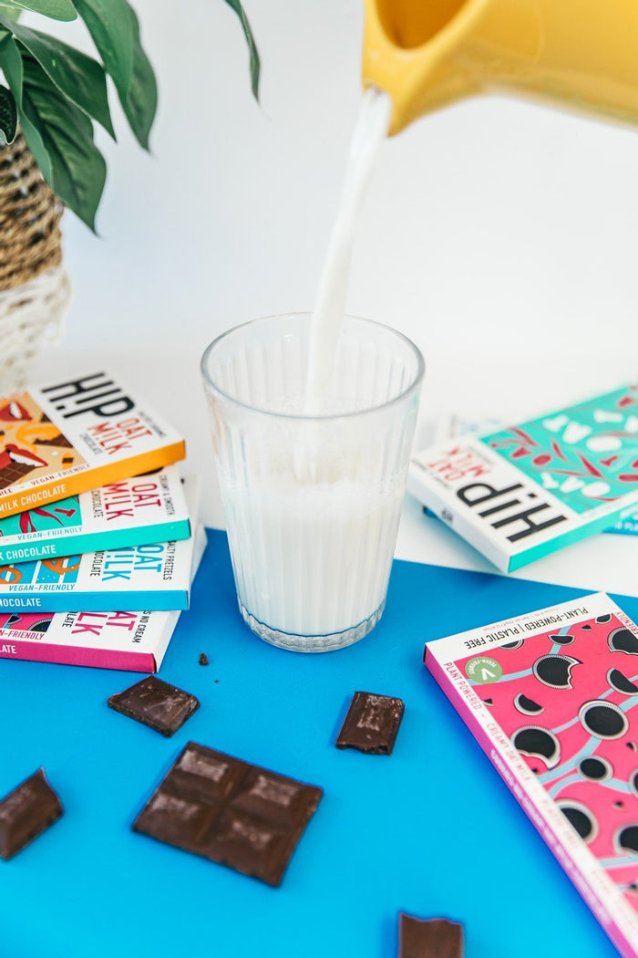 Oat milk being poured into a glass