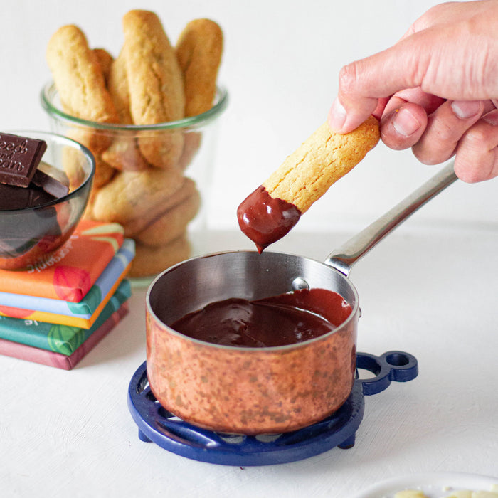 Ginger and oat biscuits dipped in dark chocolate with almonds