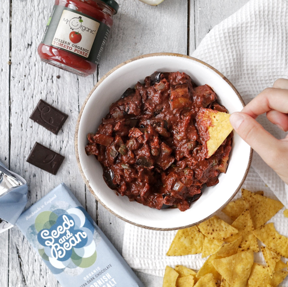 Bowl of aubergine caponata with dark chocolate