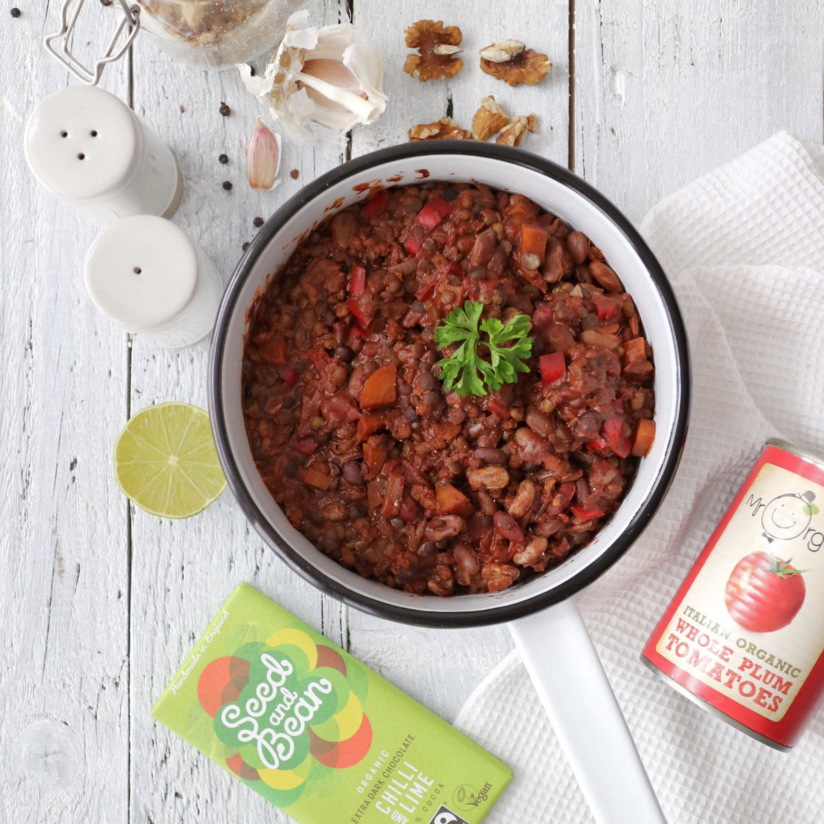 Bowl of bean chilli with walnuts and chocolate