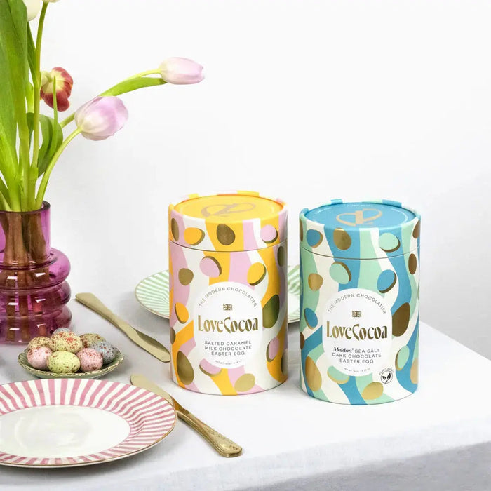 Three Love Cocoa luxury Easter eggs with their packaging