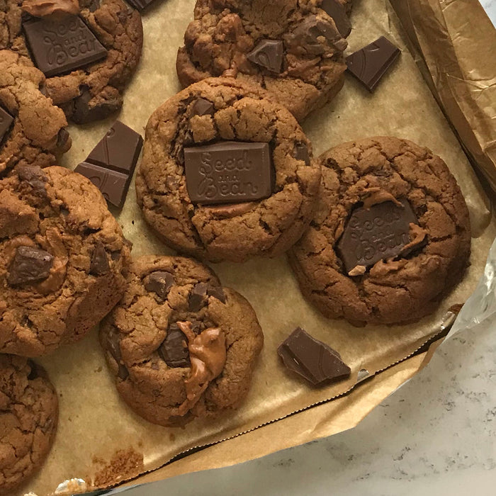 Chunky peanut butter and chocolate cookies on a rack