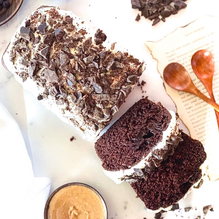 Chocolate loaf cake with creamy frosting and chocolate topping