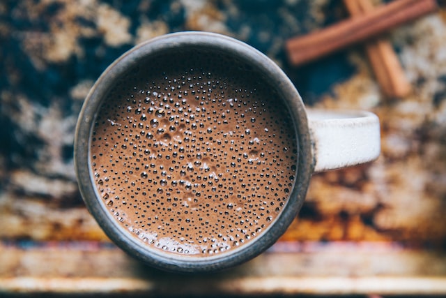 Mugs of vegan hot chocolate made with oat milk