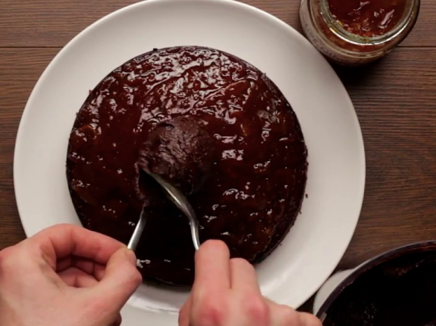 Giant Jaffa cake with glossy chocolate topping and orange