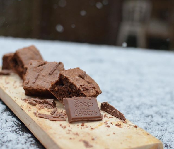 Squares of chocolate brownie with hazelnut pieces