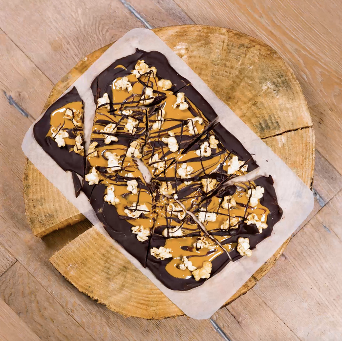 Chocolate peanut butter bark pieces with popcorn