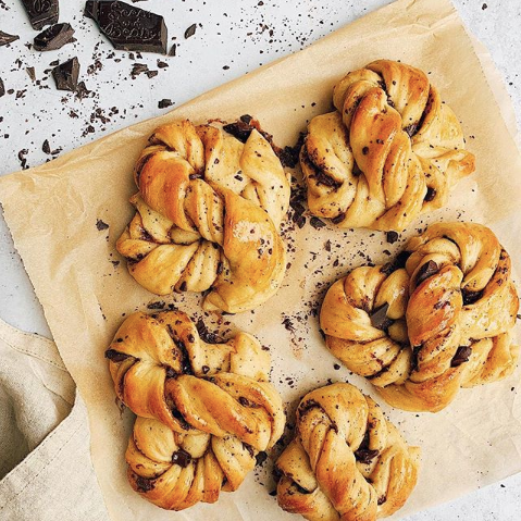 Lemon and cardamom chocolate twists on a baking tray