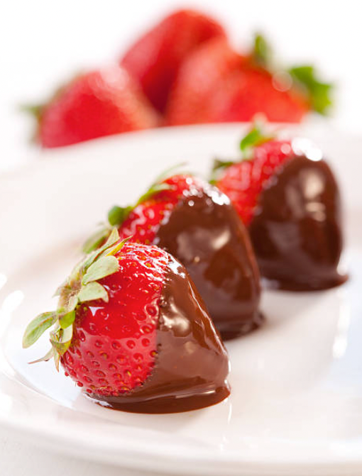 Fresh strawberries dipped in melted chocolate