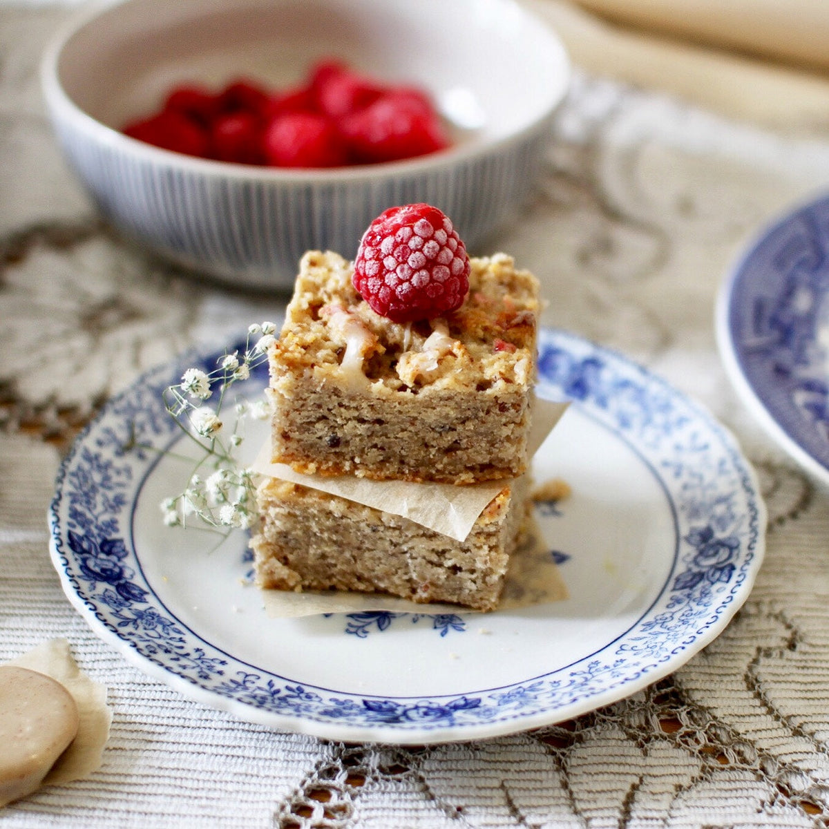 Gluten-free raspberry and white chocolate blondies stacked