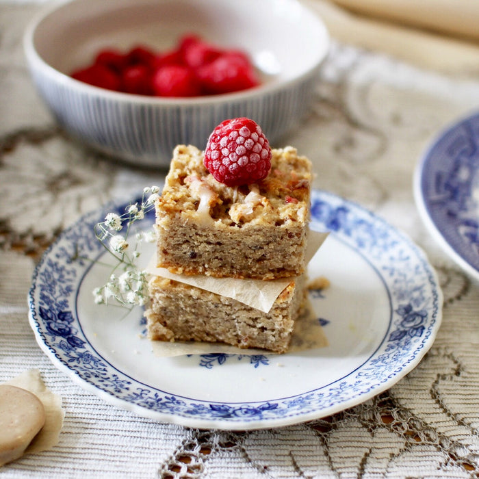 Gluten-free raspberry and white chocolate blondies stacked