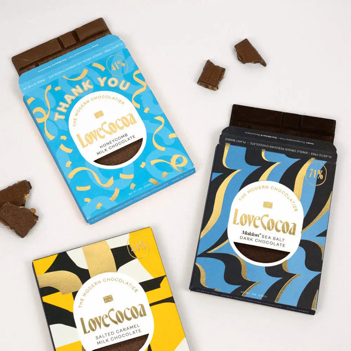 Wrapped corporate chocolate gifts on an office desk