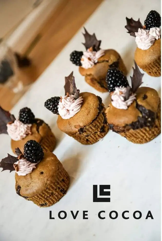 Vegan spelt muffins with icing and chocolate holly leaves