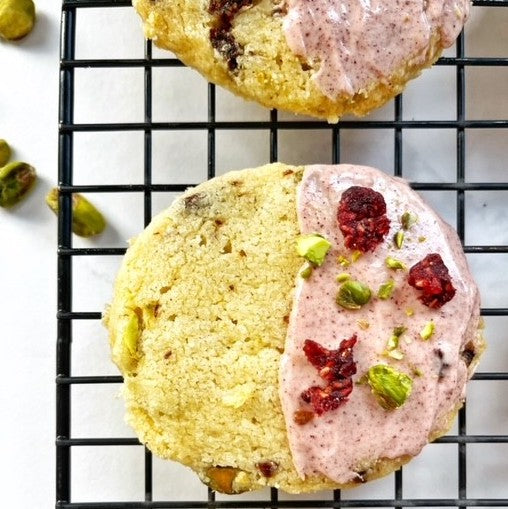 Raspberry pistachio shortbread biscuits dipped in white chocolate