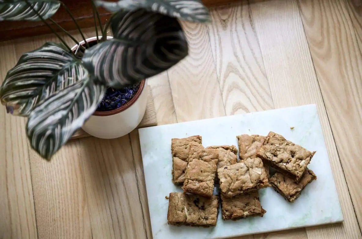 Fudgy butterscotch blondie squares on a board