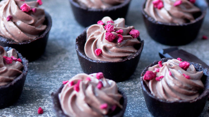 Individual dark chocolate mousse cups ready to serve