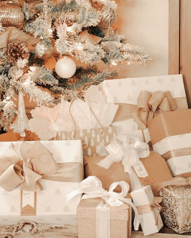 Christmas chocolate gifts for her wrapped under a tree