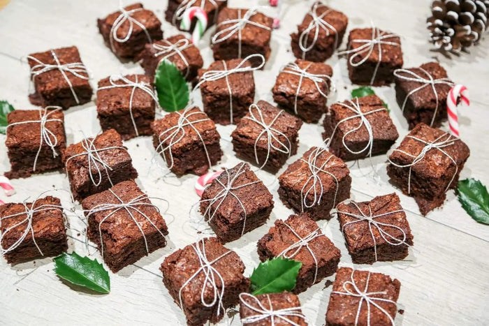 Chocolate brownie squares tied with festive string like presents