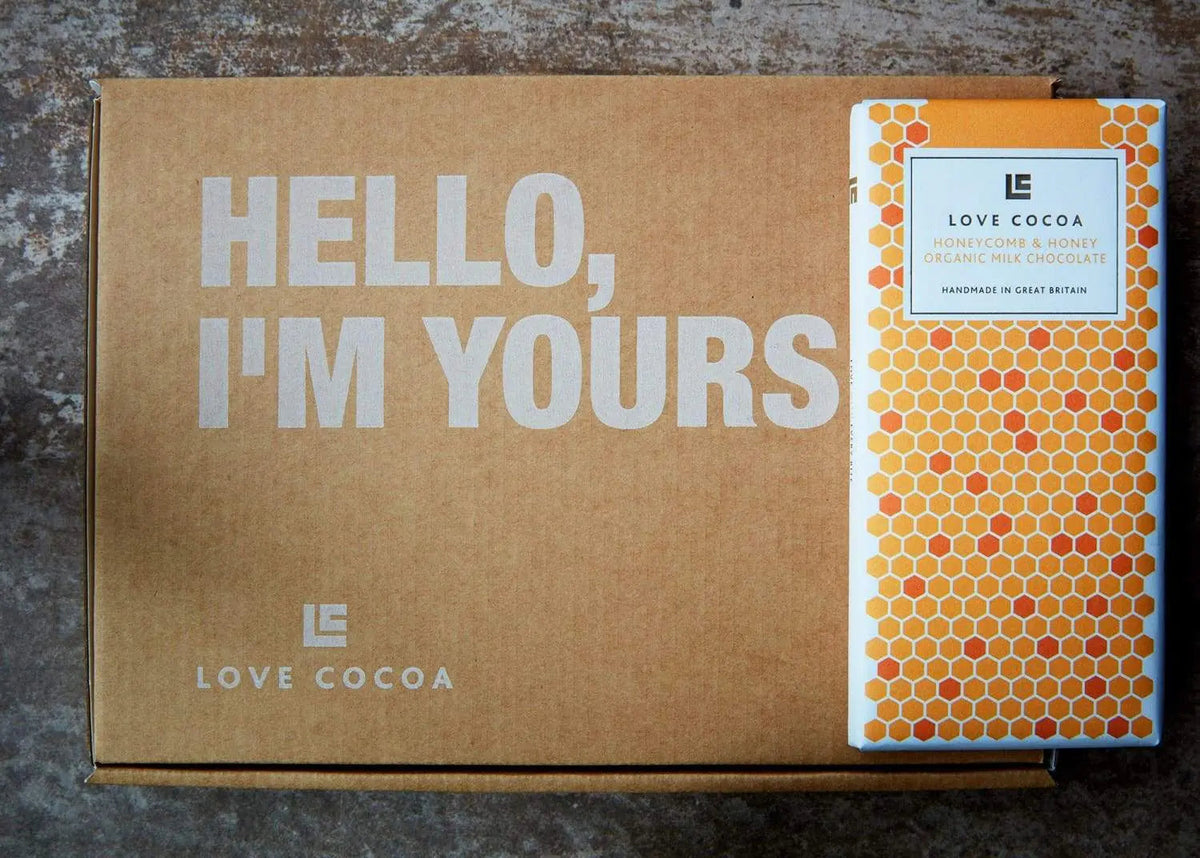 Chocolate gift being posted through a letterbox