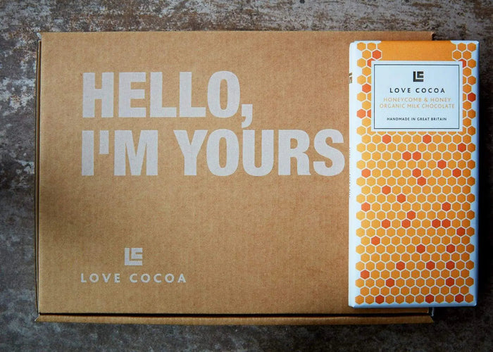 Chocolate gift being posted through a letterbox
