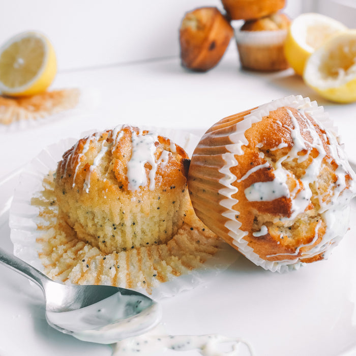 Lemon and poppyseed muffins with chocolate chunks and lemon glaze