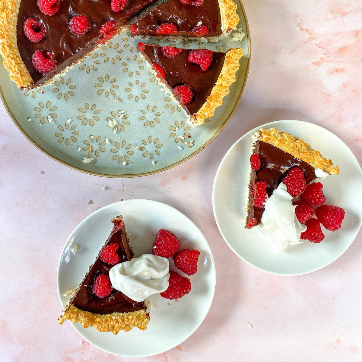 Coconut macaron tart filled with chocolate ganache