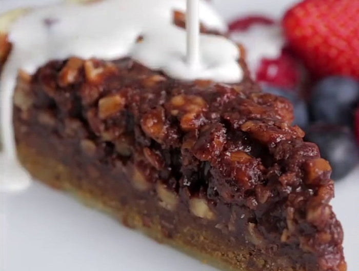 Hazelnut chocolate tart served with berries and oat cream