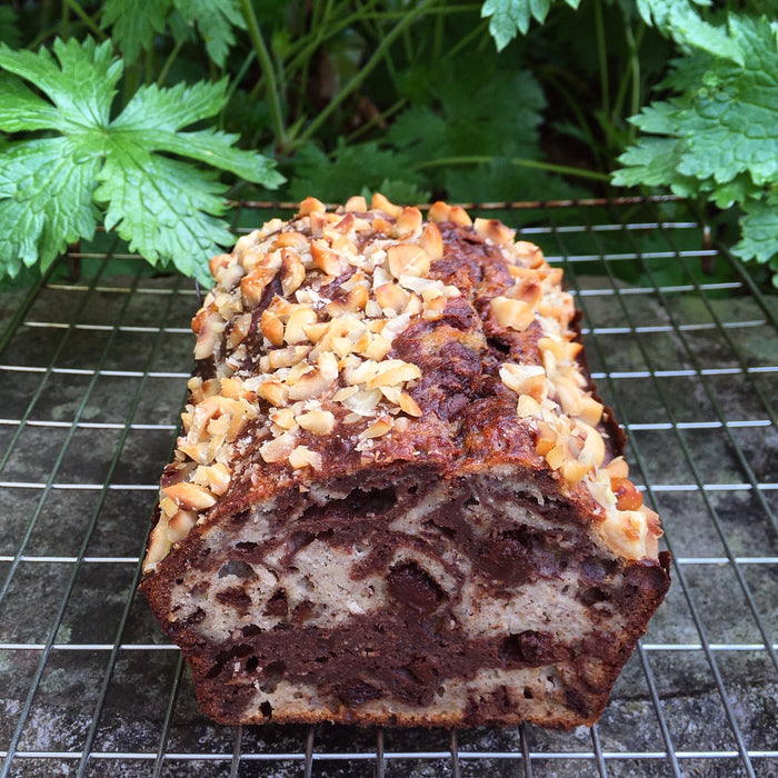 Marbled hazelnut mocha banana bread topped with hazelnuts