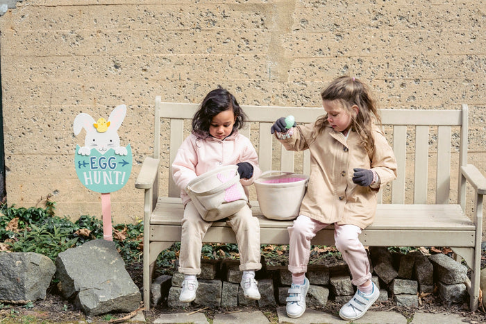 Family on an Easter egg hunt outdoors