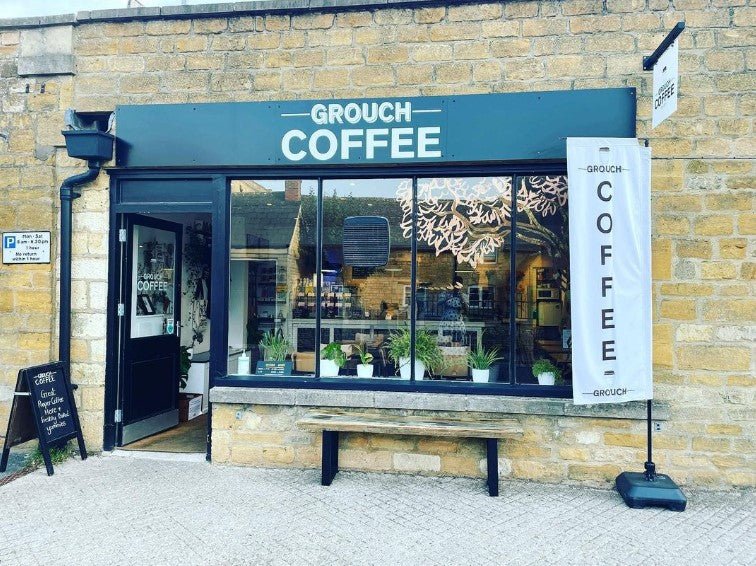 Grouch Coffee shop counter with coffee and baked goods