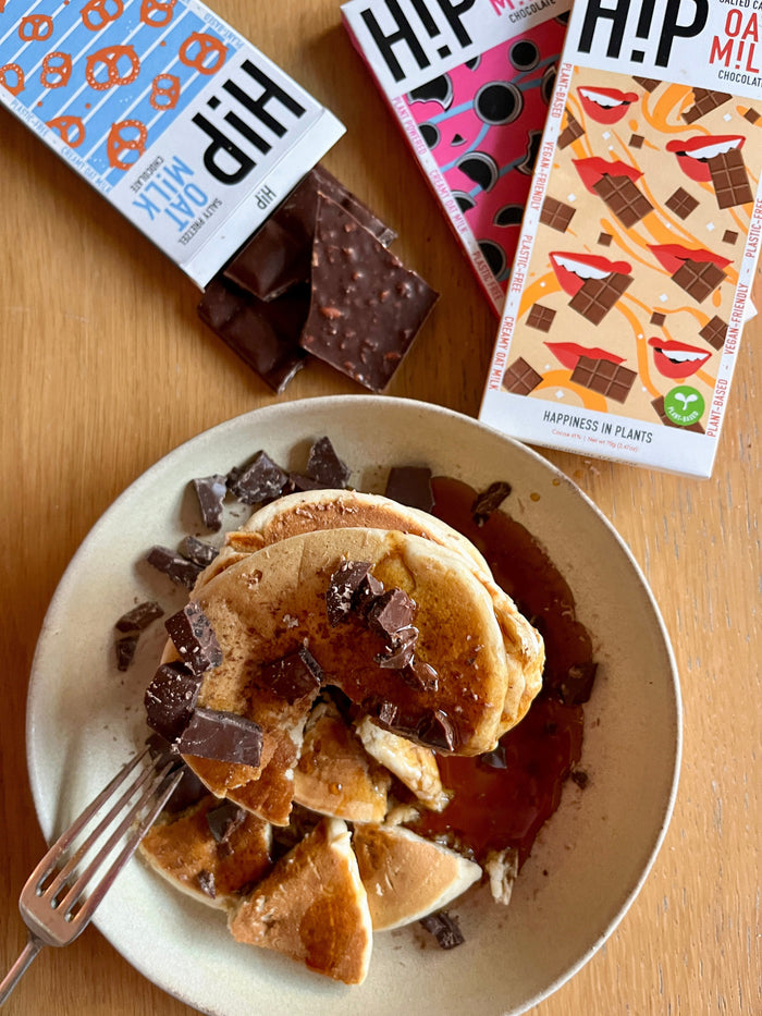 Vegan chocolate chip pancakes stacked on a plate