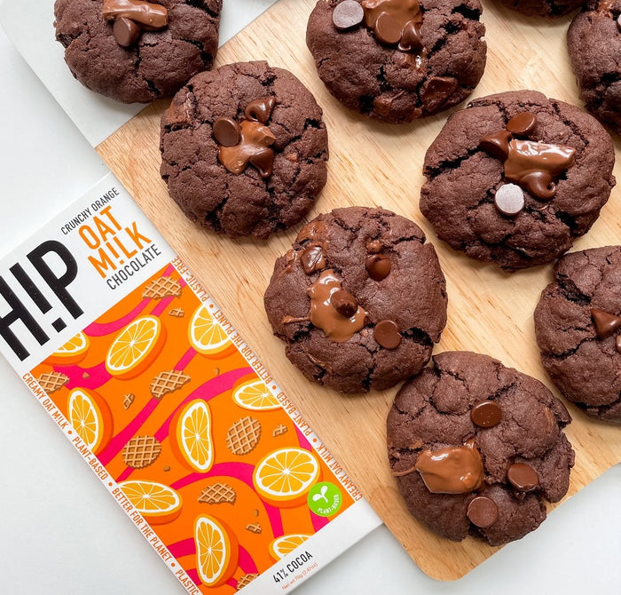 Gooey vegan chocolate orange cookies on a baking tray
