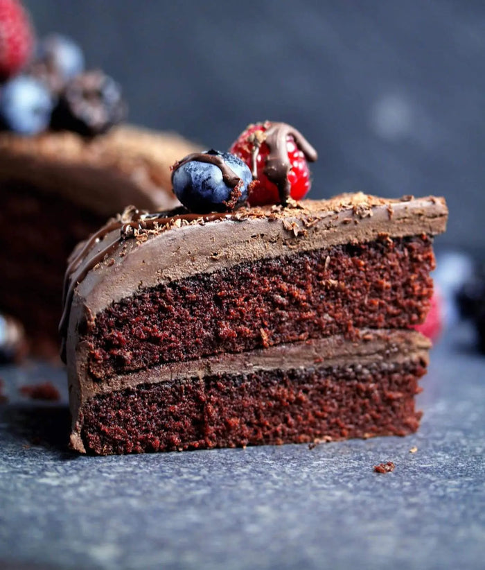 Vegan avocado chocolate cake with glossy chocolate frosting