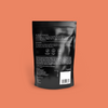 COCO Sour Apple Sweets 100g, back of pouch on a coral background