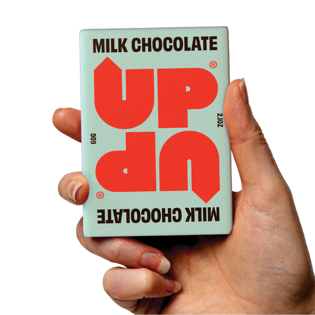 UP-UP Original Milk Chocolate 60g, bar held in hand