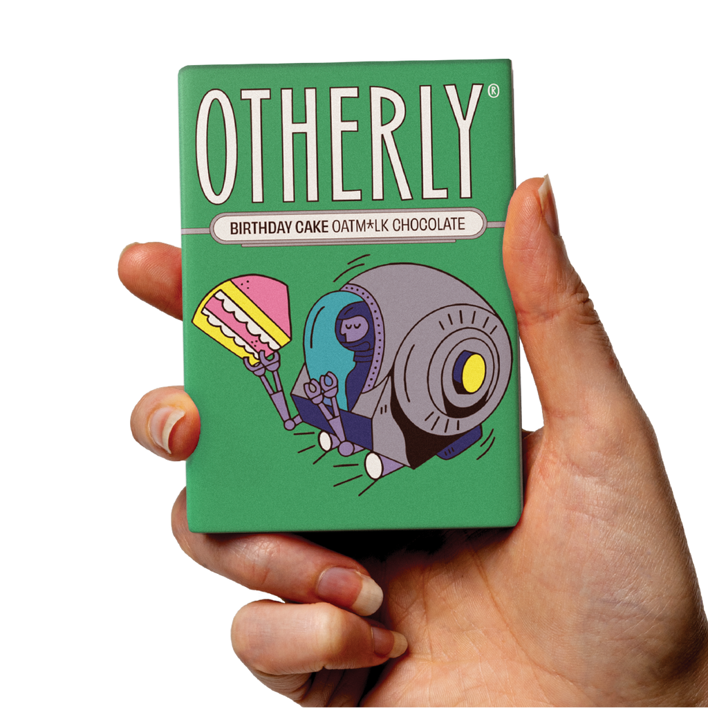 OTHERLY Birthday Cake Oat M!lk Chocolate 60g, bar held in hand