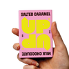 UP-UP Salted Caramel Milk Chocolate 60g, bar held in hand