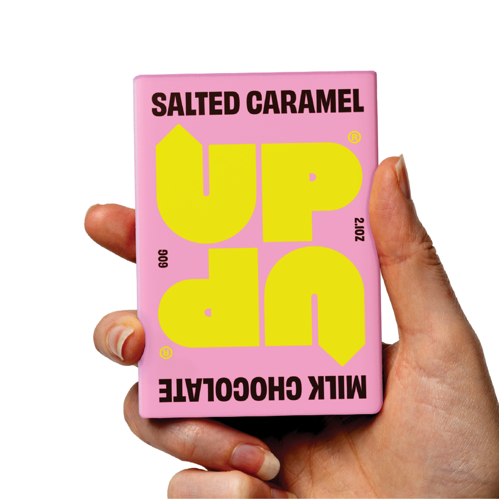 UP-UP Salted Caramel Milk Chocolate 60g, bar held in hand