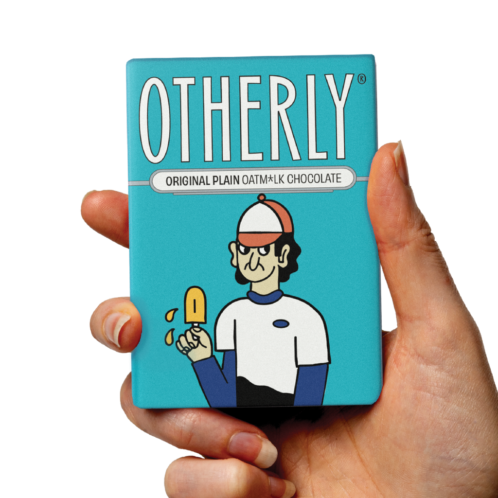 OTHERLY Original Plain Oat M!lk Chocolate 60g, bar held in hand