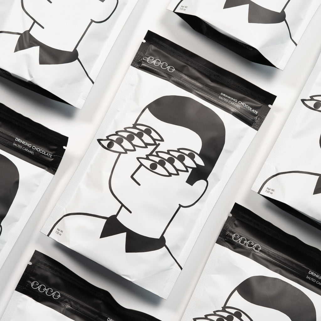 COCO Isle of Skye Salted Caramel Drinking Chocolate 200g, pouches laid out diagonally