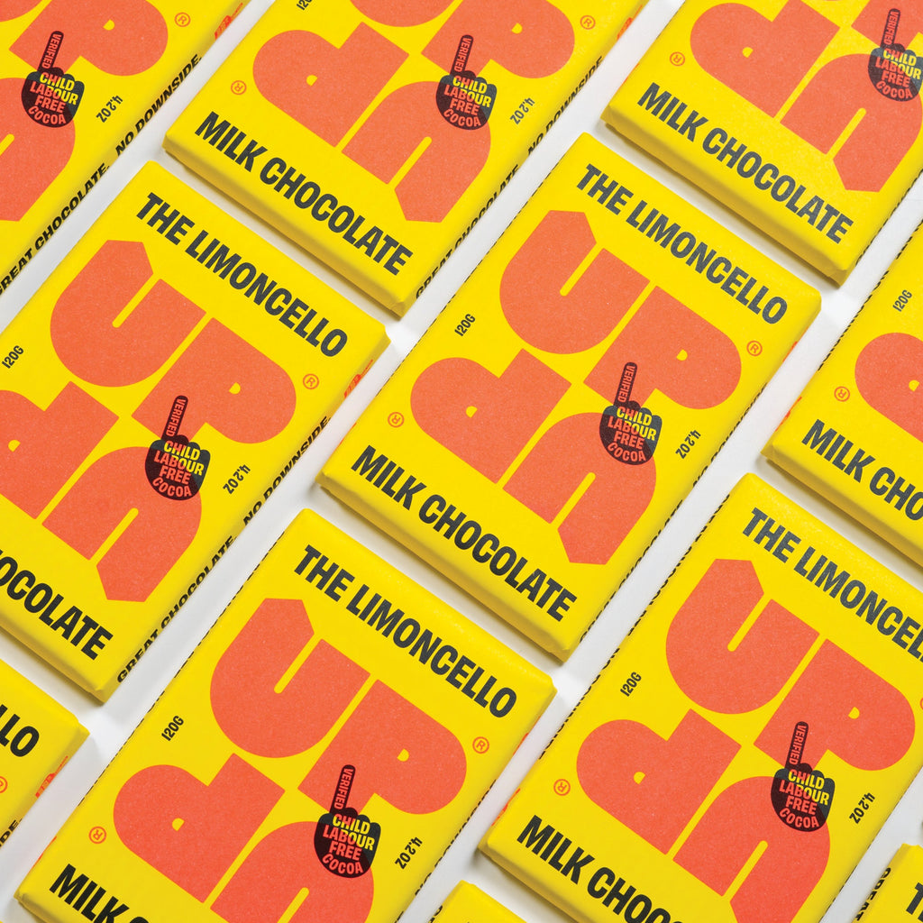 UP-UP The Limoncello Milk Chocolate 120g, rows of packs laid out diagonally