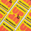 UP-UP The Limoncello Milk Chocolate 120g, close-up of packs laid out diagonally