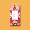 COCO Colombian Milk 40% Chocolate bar, front of pack on an orange background