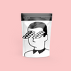 COCO Isle of Skye Salted Caramel Drinking Chocolate 200g, front of pouch on a pink background