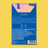 COCO Caramelised Hazelnuts in milk chocolate, back of box on a yellow background